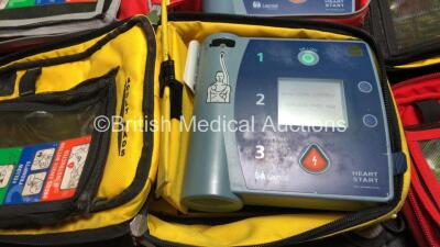 3 x Laerdal Heartstart FR2+ Defibrillators and 1 x Philips Heartstart FR2+ Defibrillators with 4 x Batteries and 3 x Skintact Electrodes in Carry Bags (All Power Up and Pass Self Test) *SN 0408274811,1207267095,1010990286,1007258754* - 2