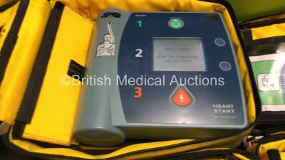 2 x Laerdal Heartstart FR2 Defibrillators and 1 x Philips FR2+ Heartstart Defibrillator with 3 x Batteries and 6 x Skintact Electrodes in Carry Bags (All Power Up and Pass Self Test) *SN 1010990288,0600006373,0900012338* - 3