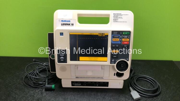 Medtronic Lifepak 12 Biphasic Defibrillator / Monitor with 2 x Batteries, AC Power Adapter, 1 x Paddle Lead and 1 x Physio Control 3 Lead ECG Lead (Powers Up)