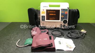 Medtronic Lifepak 12 Biphasic Defibrillator / Monitor Including ECG,NIBP,Sp02,C02 and Printer Options with 1 x Lifepak Battery 1 x Paddle Lead 2 x Infant Sp02 Sensors, and 3 x BP Cuffs (Powers Up) *SN 37797947*