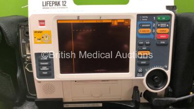 Medtronic Lifepak 12 Biphasic Defibrillator / Monitor Including ECG,NIBP,Sp02,C02 and Printer Options with 1 x Lifepak Battery 1 x Paddle Lead 2 x Infant Sp02 Sensors, and 3 x BP Cuffs (Powers Up) *SN 37797947* - 2