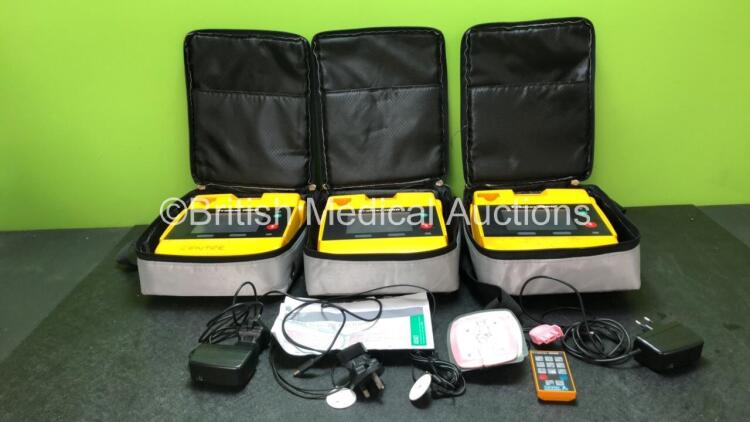 3 x Trainer 1000 Defibrillators with 2 x Power Supplies and 1 x Electrode (2 x Power Up, 1 x No Power)