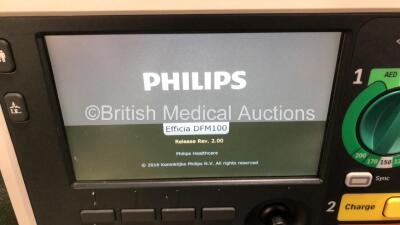 2 x Philips Efficia DFM100 Defibrillators *Mfd - 2019 / 2019* with ECG and Printer Options Including 2 x 3 Lead ECG Leads, 2 x Paddle Leads and 2 x Philips Rechargeable Li-ion Battery Packs (Both Power Up) - 2