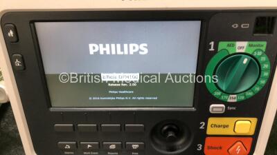 2 x Philips Efficia DFM100 Defibrillators *Mfd - 2019 / 2019* with ECG and Printer Options Including 2 x 3 Lead ECG Leads, 2 x Paddle Leads and 2 x Philips Rechargeable Li-ion Battery Packs (Both Power Up) - 3