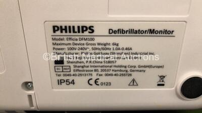 2 x Philips Efficia DFM100 Defibrillators *Mfd - 2019 / 2019* with ECG and Printer Options Including 2 x 3 Lead ECG Leads, 2 x Paddle Leads and 2 x Philips Rechargeable Li-ion Battery Packs (Both Power Up) - 8