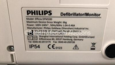 2 x Philips Efficia DFM100 Defibrillators *Mfd - 2019 / 2019* with ECG and Printer Options Including 2 x 3 Lead ECG Leads, 2 x Paddle Leads and 2 x Philips Rechargeable Li-ion Battery Packs (Both Power Up) - 7