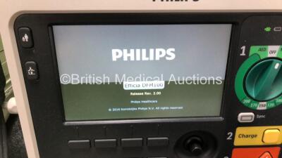 2 x Philips Efficia DFM100 Defibrillators *Mfd - 2019 / 2019* with ECG and Printer Options Including 2 x 3 Lead ECG Leads, 2 x Paddle Leads and 2 x Philips Rechargeable Li-ion Battery Packs (Both Power Up) - 2