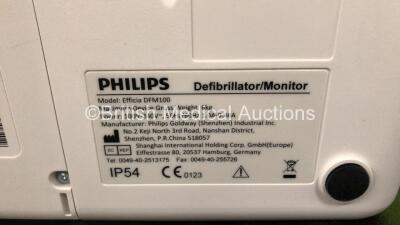 2 x Philips Efficia DFM100 Defibrillators *Mfd - 2019 / 2019* with ECG and Printer Options Including 2 x 3 Lead ECG Leads, 2 x Paddle Leads and 2 x Philips Rechargeable Li-ion Battery Packs (Both Power Up) - 6