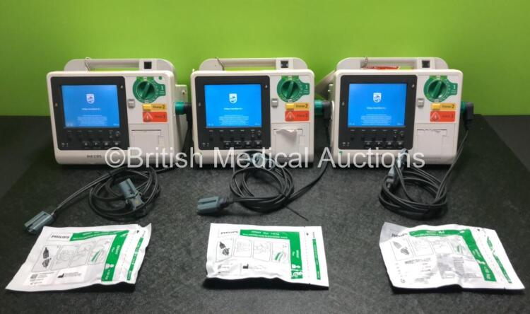 Job Lot Including 2 x Philips Heartstart XL+ Defibrillators Including Pacer, ECG and Printer Options with 2 x Paddle Leads and 2 x Batteries and 1 x Philips Heartstart XL+ Defibrillator Including ECG and Printer Options with 1 x Paddle Lead, 1 x Battery a