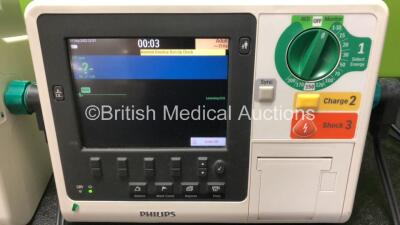 3 x Philips Heartstart XL+ Defibrillators Including ECG and Printer Options with 3 x Paddle Leads, 3 x Philips Multifunction Electrode Pads *All in Date* and 3 x Batteries (All Power Up) - 4