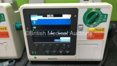 3 x Philips Heartstart XL+ Defibrillators Including ECG and Printer Options with 3 x Paddle Leads, 3 x Philips Multifunction Electrode Pads *2 Expired, 1 in Date* and 3 x Batteries (All Power Up) - 4