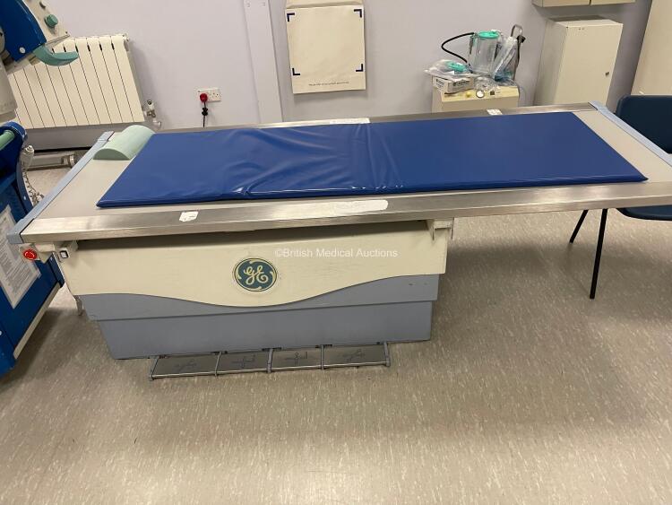 GE Proteus X-Ray Bucky Suite (2021 Tube) Including Elevating Table, Overhead Bucky OTS Assembly, X-ray Wall Stand, System Cabinet, Ceiling Rails and Operator Console. System has been Professionally Removed; System Sold as Non-Working Due to Tube Pivot Fau