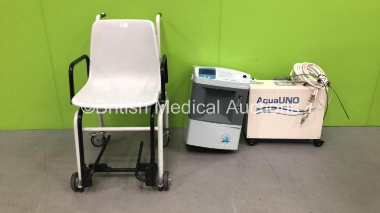 1 x Seca Wheelchair Weighing Scales, 1 x OxyLife Oxygen Concentrator (1 x Missing Wheel) and 1 x Fresenius AquaUNO Water Treatment System (Powers Up)