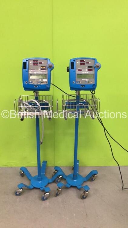 1 x GE Dinamap Pro 400 Vital Signs Monitor on Stand and 1 x GE Dinamap Pro 400V2 Vital Signs Monitor on Stand (Both Power Up)