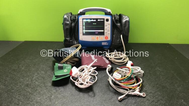 Zoll X Series Monitor/Defibrillator Including ECG, SPO2, NIBP, CO2 and Printer Options with 1 x Sure Power II Battery, 1 x NIBP Cuff and Hose, 1 x 4 Lead ECG Lead, 1 x 6 Lead ECG Lead, 1 x Paddle Lead and 1 x SPO2 Finger Sensor in Carry Bag (Powers Up and