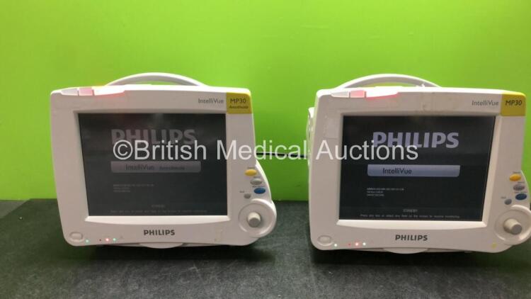 2 x Philips IntelliVue MP30 Patient Monitors with 2 x Philips IntelliVue X2 Handheld Patient Monitors with ECG, SpO2, NBP, Press and Temp Options (All Power Up with Damage-See Photos)