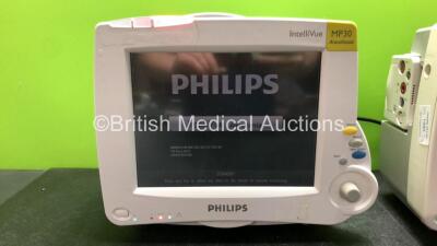 2 x Philips IntelliVue MP30 Patient Monitors with 2 x Philips IntelliVue X2 Handheld Patient Monitors with ECG, SpO2, NBP, Press and Temp Options (All Power Up with Damage-See Photos) - 2