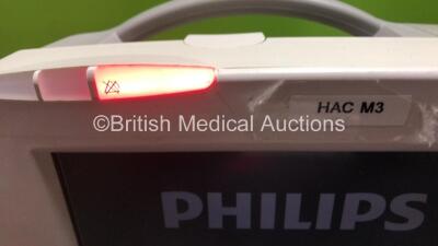 2 x Philips IntelliVue MP30 Patient Monitors (Both Power Up with Damage to Casing - See Photos) with 2 x Philips IntelliVue X2 Handheld Patient Monitors Including Press, Temp, NBP, SpO2 and ECG/Resp Options with 2 x Batteries (Both Power Up, 1 x Damaged C - 3