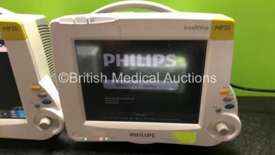 2 x Philips IntelliVue MP30 Patient Monitors (Both Power Up with Damage to Casing - See Photos) with 2 x Philips IntelliVue X2 Handheld Patient Monitors Including Press, Temp, NBP, SpO2 and ECG/Resp Options with 2 x Batteries (Both Power Up, 1 x Damaged C - 4