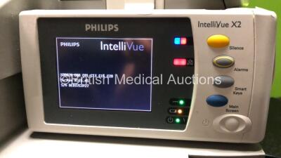 2 x Philips IntelliVue MP30 Patient Monitors (Both Power Up with Damage to Casing - See Photos) with 2 x Philips IntelliVue X2 Handheld Patient Monitors Including Press, Temp, NBP, SpO2 and ECG/Resp Options with 2 x Batteries (Both Power Up, 1 x Damaged C - 9