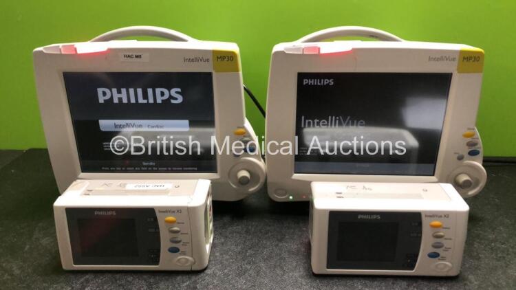 2 x Philips IntelliVue MP30 Patient Monitors (Both Power Up, 1 x Damage to Casing - See Photos) with 2 x Philips IntelliVue X2 Handheld Patient Monitors Including Press, Temp, NBP, SpO2 and ECG/Resp Options with 2 x Batteries (Both Power Up, 1 x Damaged C