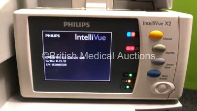 2 x Philips IntelliVue MP30 Patient Monitors (Both Power Up, 1 x Damage to Casing - See Photos) with 2 x Philips IntelliVue X2 Handheld Patient Monitors Including Press, Temp, NBP, SpO2 and ECG/Resp Options with 2 x Batteries (Both Power Up, 1 x Damaged C - 5