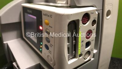 2 x Philips IntelliVue MP30 Patient Monitors (Both Power Up, 1 x Damage to Casing - See Photos) with 2 x Philips IntelliVue X2 Handheld Patient Monitors Including Press, Temp, NBP, SpO2 and ECG/Resp Options with 2 x Batteries (Both Power Up, 1 x Damaged C - 6