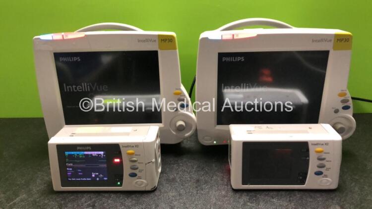 2 x Philips IntelliVue MP30 Patient Monitors (Both Power Up, 1 x Damage to Casing - See Photos) with 2 x Philips IntelliVue X2 Handheld Patient Monitors Including Press, Temp, NBP, SpO2 and ECG/Resp Options with 2 x Batteries (Both Power Up with Damage to