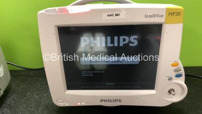 2 x Philips IntelliVue MP30 Patient Monitors (1 x No Power with Printer Option and Cracked Screen, 1 x Powers Up with Missing Dial - See Photos) with 2 x Philips M3001A Modules Including Press, Temp, NBP, SpO2 and ECG/Resp Options (1 x Damaged Casing - Se - 5