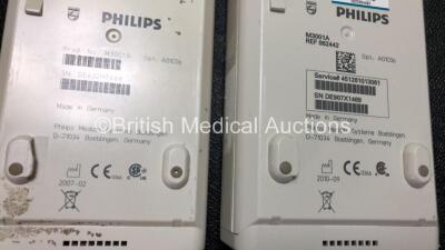 2 x Philips IntelliVue MP30 Patient Monitors (1 x No Power with Printer Option and Cracked Screen, 1 x Powers Up with Missing Dial - See Photos) with 2 x Philips M3001A Modules Including Press, Temp, NBP, SpO2 and ECG/Resp Options (1 x Damaged Casing - Se - 9