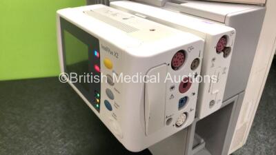 Job Lot Including 1 x Philips IntelliVue MP70 Touch Screen Patient Monitor (Powers Up) 1 x Philips IntelliVue X2 Patient Monitor with Press, Temp, NBP, SPO2 and ECG Resp Options (Powers Up with Damage to Casing - See Photos) and 1 x Philips M3015A Opt: C0 - 4