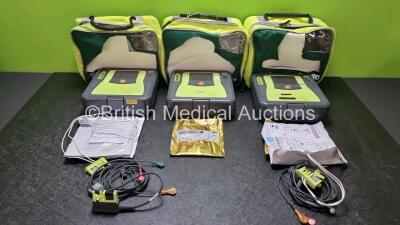 3 x Zoll AED PRO Defibrillators with 3 x Batteries, 2 x 3 Lead ECG Leads, 5 x Electrode Packs *All Out of Date* (All Power Up) in Carry Cases *SN AA11C020017 / AA10C016641 / AA10C016611*