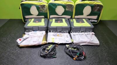 3 x Zoll AED PRO Defibrillators with 3 x Batteries, 2 x 3 Lead ECG Leads, 5 x Electrode Packs *3 x in Date 2 x Out of Date* (All Power Up) in Carry Cases *SN AA10C016880 / AA13C027919 / AA10C016908*