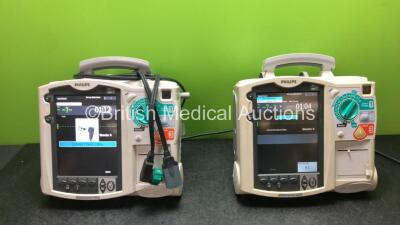 2 x Philips Heartstart MRx Defibrillators Including ECG and Printer Options and 1 x Paddle Lead (both Power Up with Stock Batteries, Batteries Not Included)