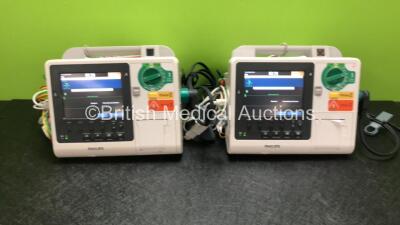 2 x Philips Heartstart XL+ Defibrillators Including ECG and Printer Options *Mfd 2014 / 2013* with 2 x Paddle Leads and 2 x Philips ECG Leads (All Power Up)