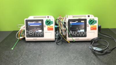 2 x Philips Heartstart XL+ Defibrillators Including ECG and Printer Options *Mfd 2013 / 2013* with 2 x Paddle Leads and 2 x Philips ECG Leads (Both Power Up)