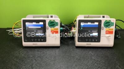 2 x Philips Heartstart XL+ Defibrillators Including ECG and Printer Options *Mfd 2015 / 2013* with 2 x Paddle Leads and 2 x Philips ECG Leads (Both Power Up)