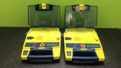 2 x Cardiac Science Powerheart AED G3 Defibrillators with 2 x Batteries (Both Power Up with 1 x Service Required)