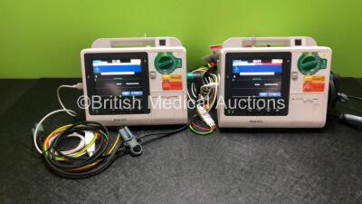 2 x Philips Heartstart XL+ Defibrillators Including ECG and Printer Options *Mfd 2014 / 2013* with 2 x Paddle Leads and 2 x Philips ECG Leads (Both Power Up)