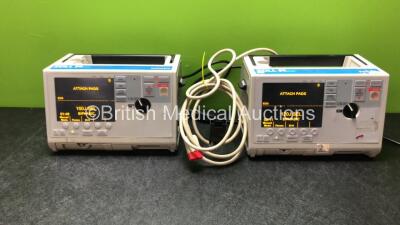 2 x Zoll M Series Biphasic 200 Joules Max Defibrillators with ECG and Printer Options and 1 x Paddle Leads (All Power Up)