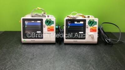 2 x Philips Heartstart XL+ Defibrillators Including Pacer, ECG and Printer Options with 2 x Paddle Leads and 2 x 3 Lead ECG Leads (Both Power Up) *SN US71514666 / US71514665*