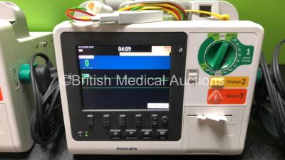 2 x Philips Heartstart XL+ Defibrillators Including Pacer, ECG and Printer Options with 2 x Paddle Leads and 2 x 3 Lead ECG Leads (Both Power Up) *SN US71514666 / US71514665* - 3