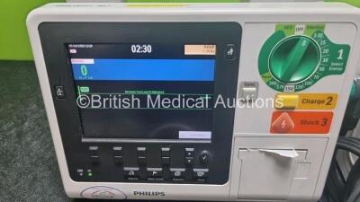 2 x Philips Heartstart XL+ Defibrillators Including Pacer, ECG and Printer Options with 2 x Paddle Leads, 2 x M3725a Test Loads and 2 x 3 Lead ECG Leads (Both Power Up) *SN US31716634 / USN307801* - 2