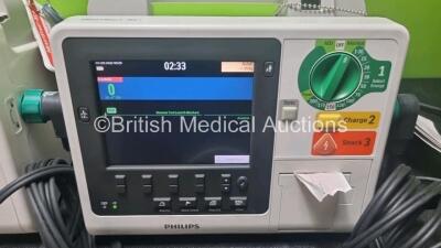 2 x Philips Heartstart XL+ Defibrillators Including Pacer, ECG and Printer Options with 2 x Paddle Leads, 2 x M3725a Test Loads and 2 x 3 Lead ECG Leads (Both Power Up) *SN US31716634 / USN307801* - 3