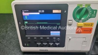 2 x Philips Heartstart XL+ Defibrillators Including ECG and Printer Options with 2 x Paddle Leads, 2 x M3725a Test Loads and 2 x 3 Lead ECG Leads (Both Power Up) *US71514445 / US71514444* - 2