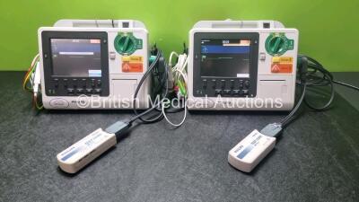 2 x Philips Heartstart XL+ Defibrillators Including ECG and Printer Options with 2 x Paddle Leads, 2 x M3725a Test Loads and 2 x 3 Lead ECG Leads (Both Power Up) *US51717133 / US6171793*