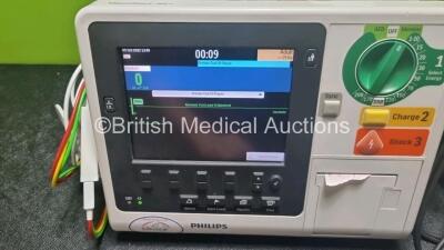 2 x Philips Heartstart XL+ Defibrillators Including ECG and Printer Options with 2 x Paddle Leads, 2 x M3725a Test Loads and 2 x 3 Lead ECG Leads (Both Power Up) *US51717133 / US6171793* - 2