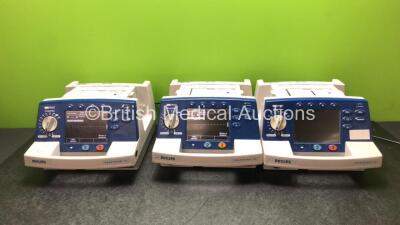 3 x Philips Heartstart XL Smart Biphasic Defibrillators Including ECG, and Printer Options (2 x Power Up and 1 x No Power) *SN US00601965 / US00582999 / US00338039*