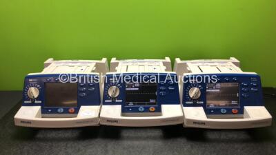 3 x Philips Heartstart XL Smart Biphasic Defibrillators Including ECG, and Printer Options (2 x Power Up and 1 x No Power) *SN US00601963 / US00469722 / US00601960*