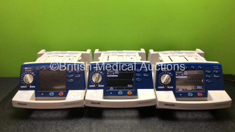 3 x Philips Heartstart XL Smart Biphasic Defibrillators Including ECG, and Printer Options (2 x Power Up and 1 x No Power) *SN US00601963 / US00469722 / US00601960*